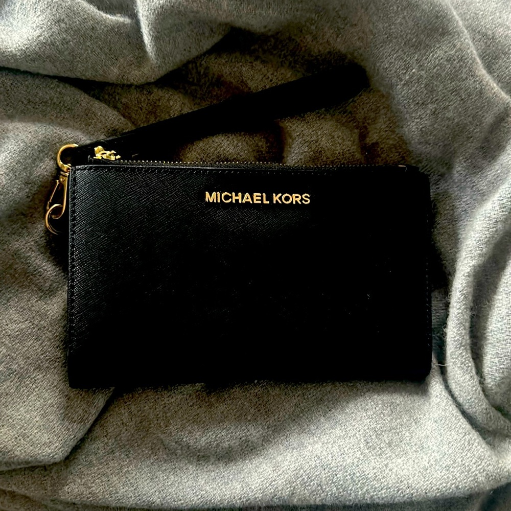 Like new black three part Michael Kors Wristlet with phone pocket
